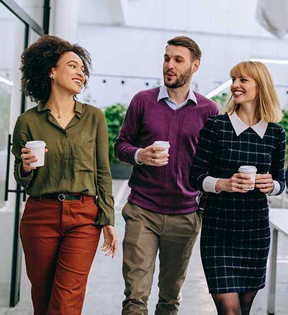 Three coworkers walking