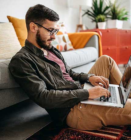 Man using laptop at home