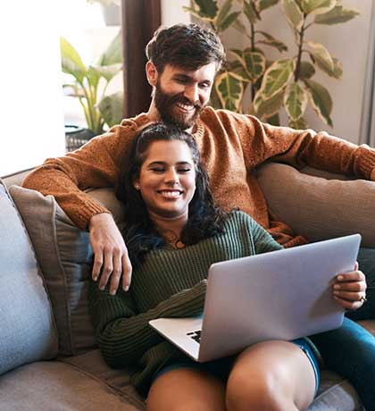 Couple on laptop at home