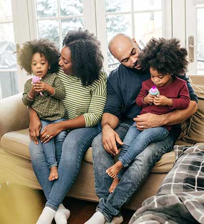 Family of four at home