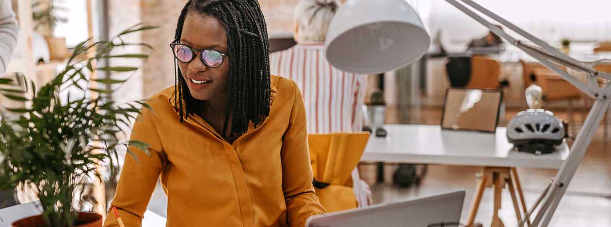 Woman working at office at desk.