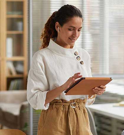 Woman using tablet in office