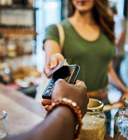 Woman paying with card at store